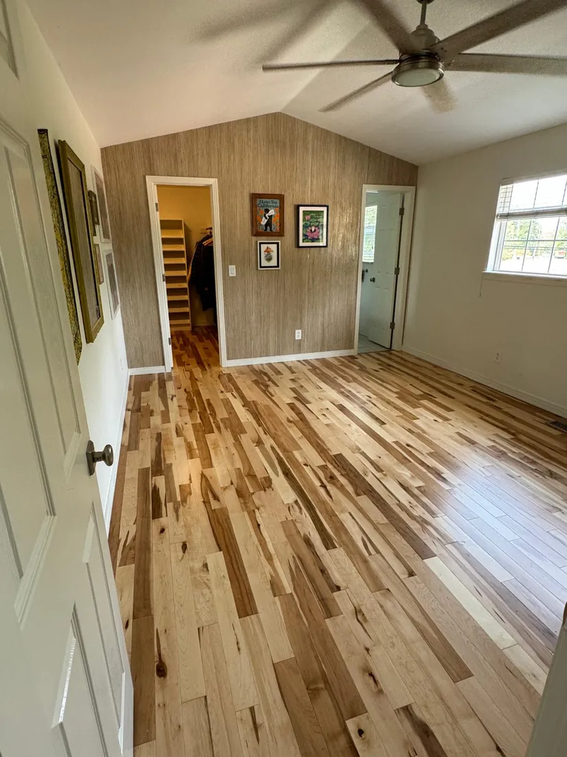 Character grade oak with varied tones running through an entry hall