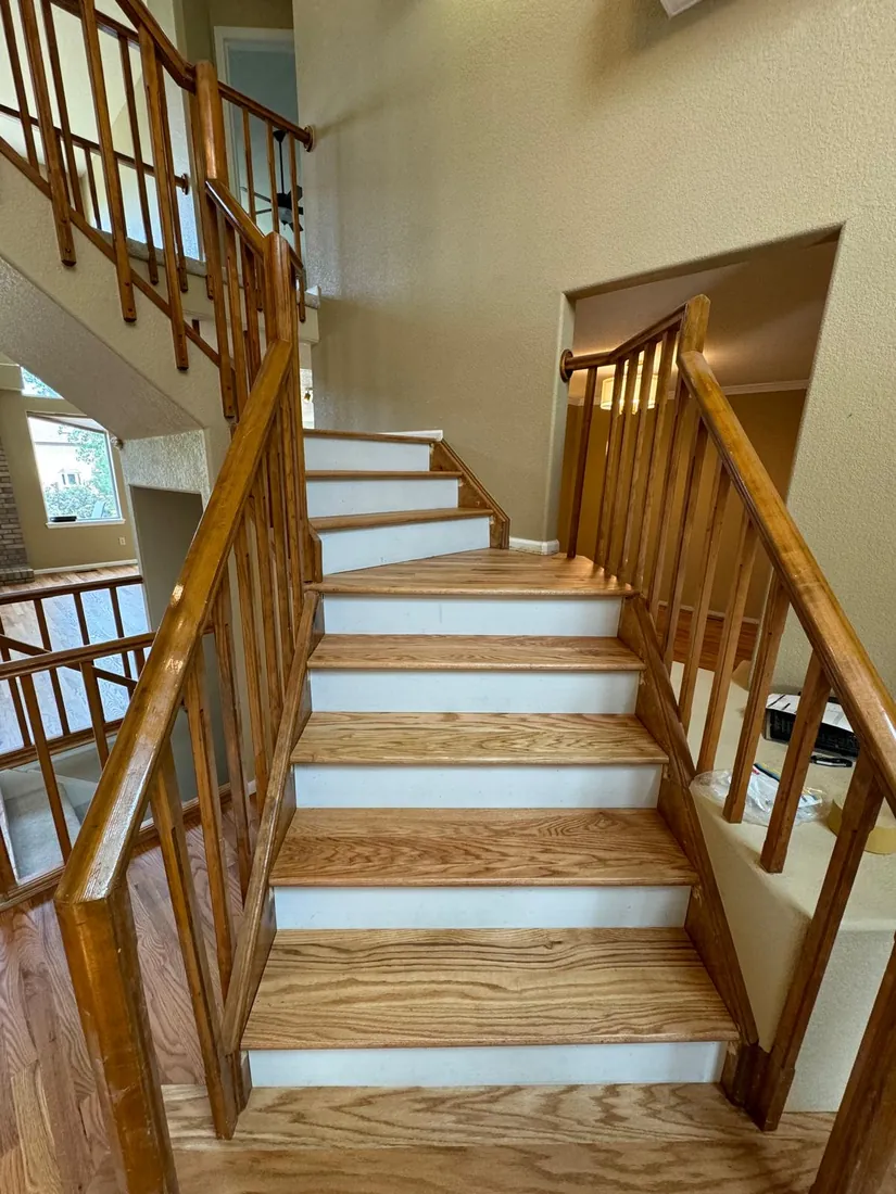 Oak staircase with finished treads and a turned spindle railing